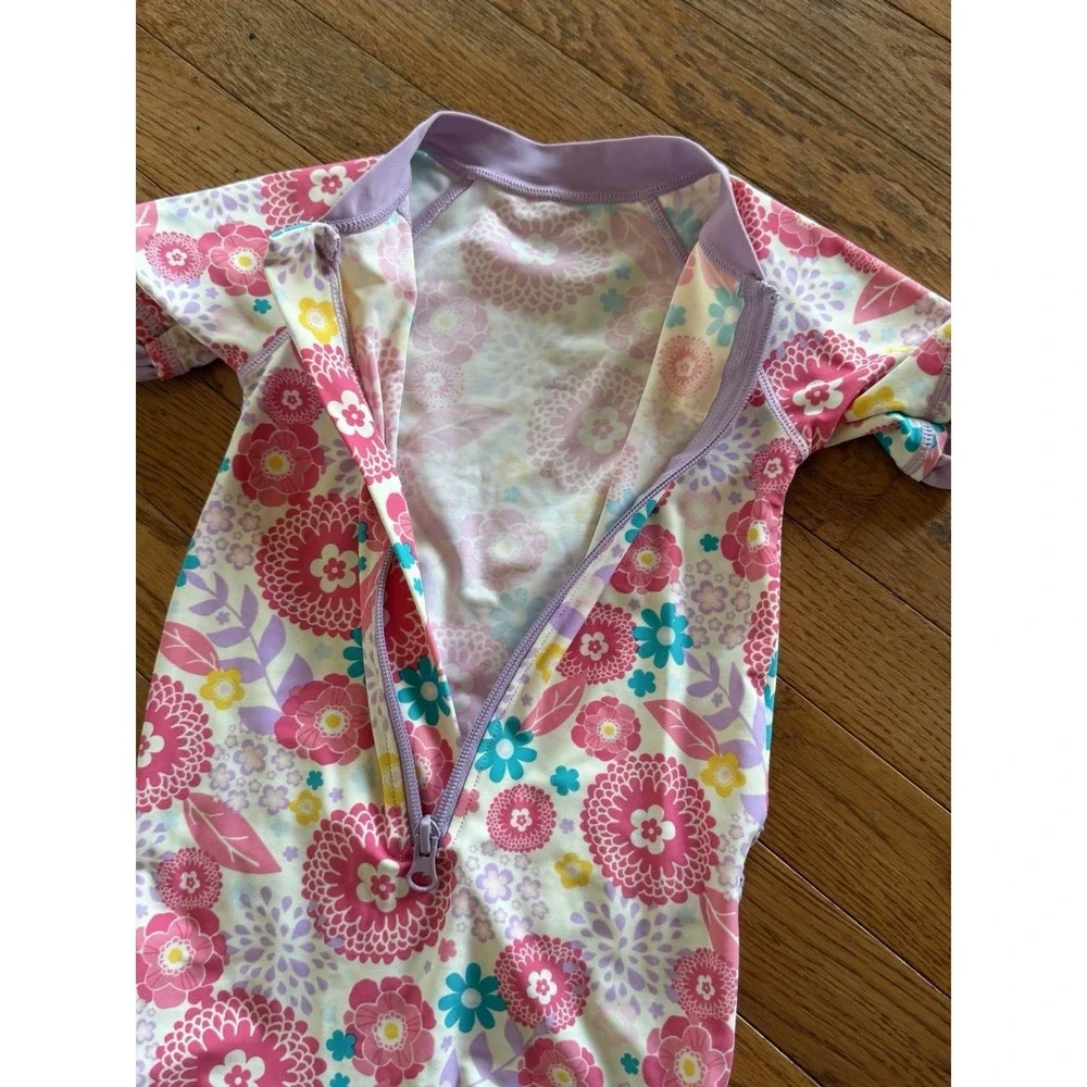 RuffleButts girls' short-sleeve one-piece rash guard swimsuit floral 2T vacation